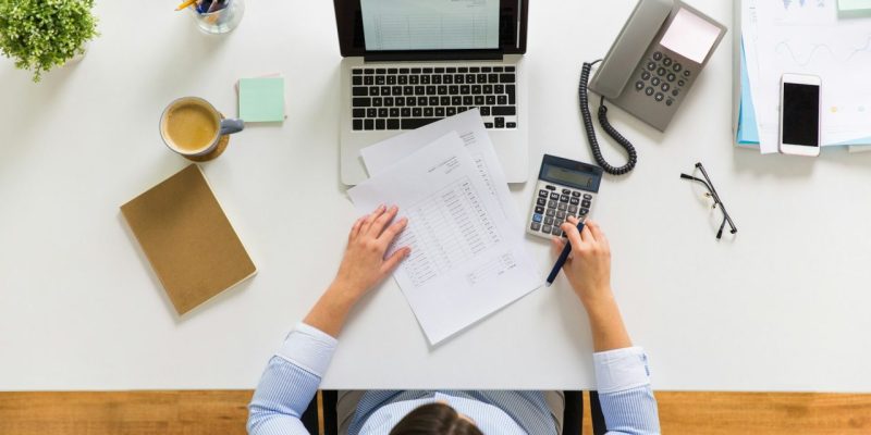 businesswoman-with-tax-report-at-office.jpg